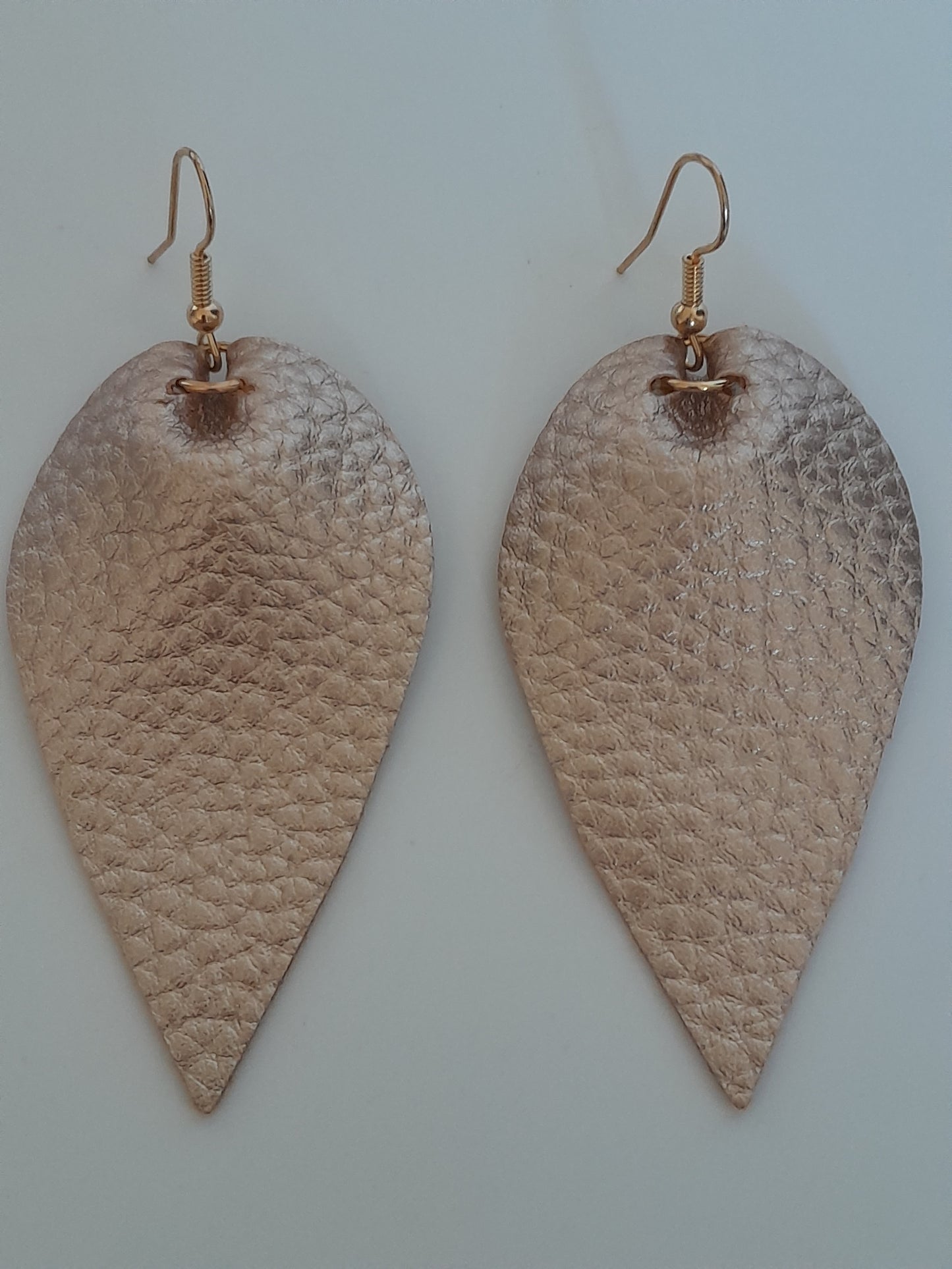 Fetching Gold Coloured Faux Leather Leaf Drop